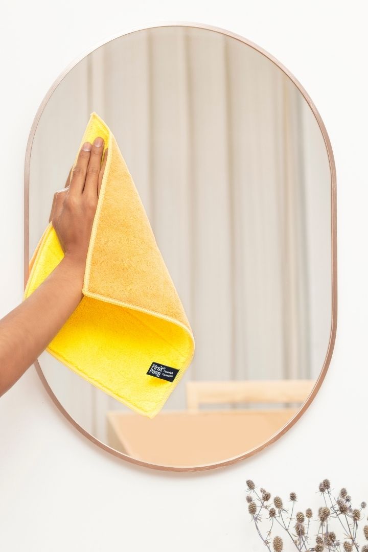 WashCloth cleaning a bathroom mirror - FirstPass